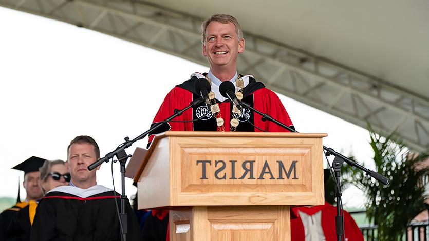 Image of President Weinman addressing graduates.